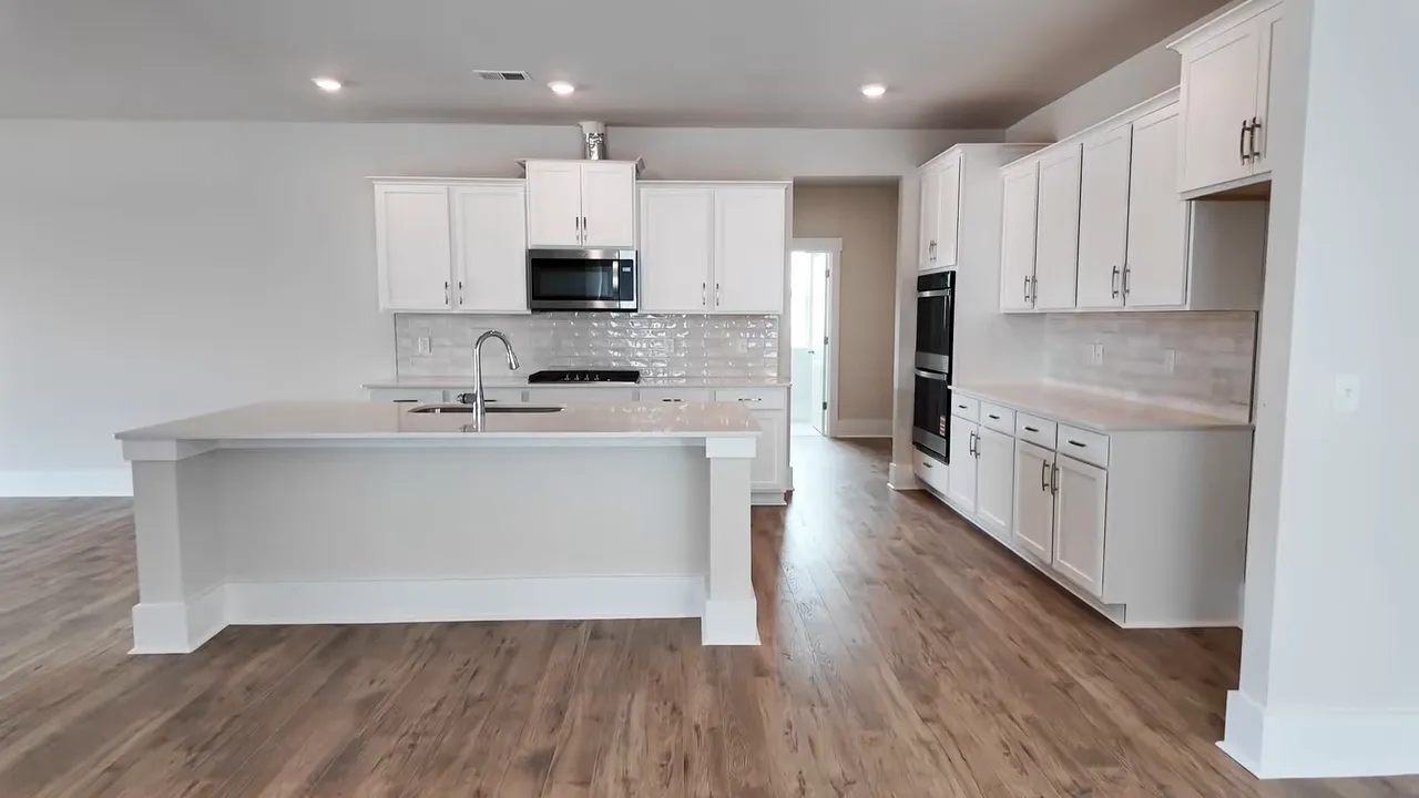 White kitchen with large island