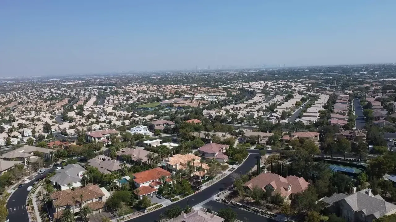 Aerial view of Las Vegas homes with text stating property taxes are 25 percent lower than the national average