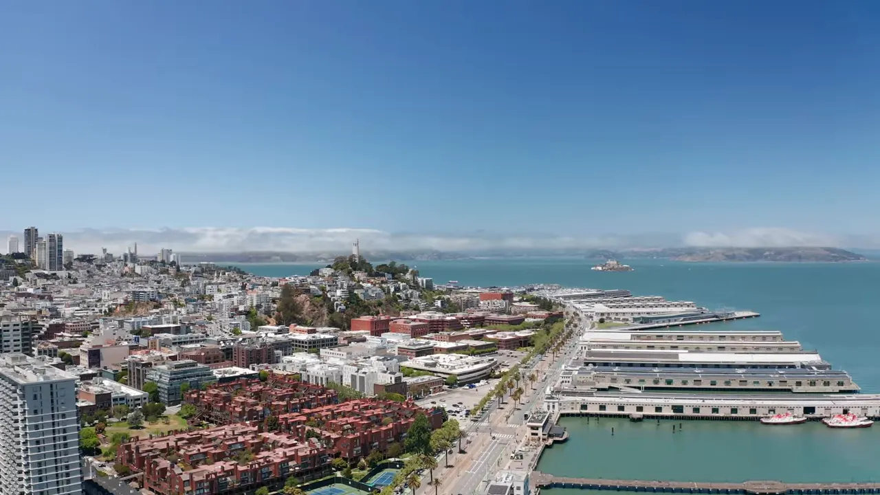 Aerial panoramic view of San Francisco waterfront and piers with blue sky