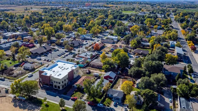 Aerial view of Erie with tree-lined streets and downtown buildings