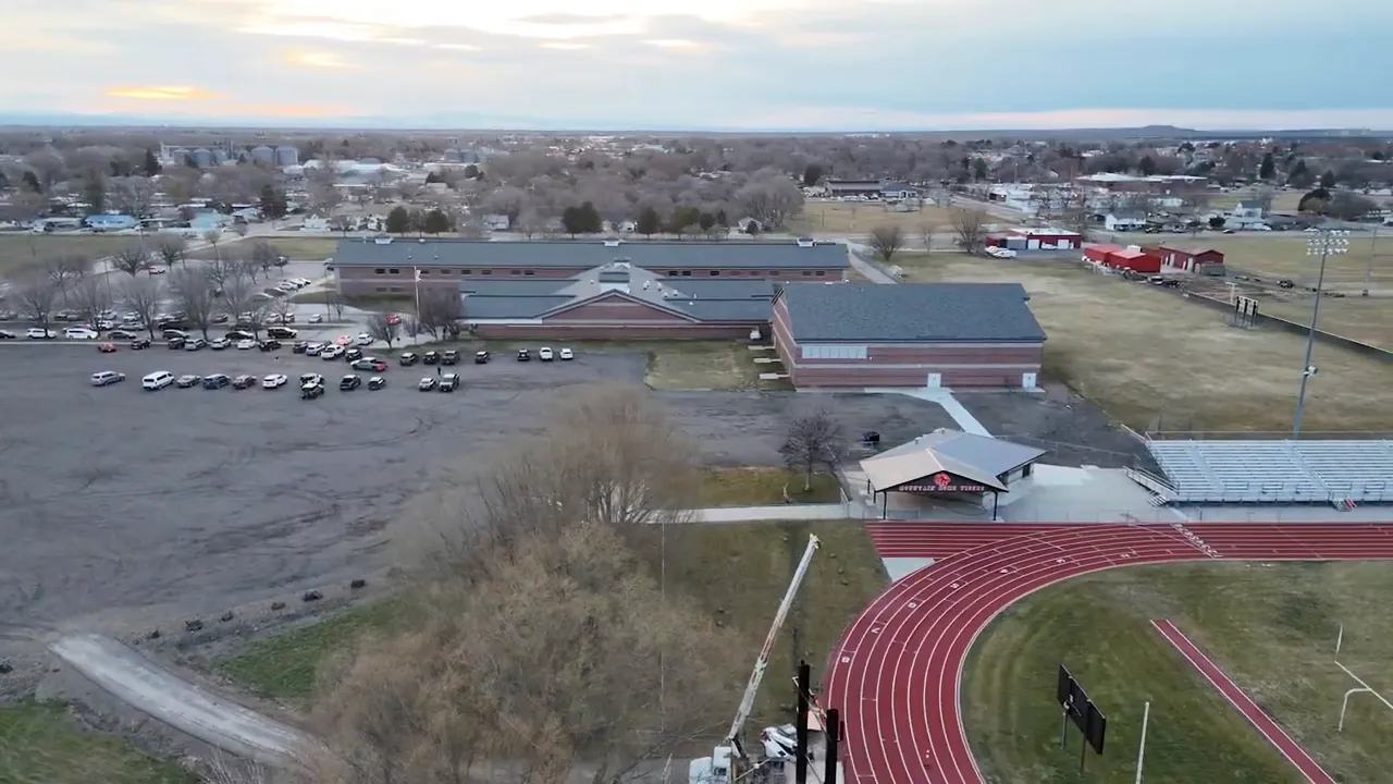 Aerial view of a Mountain Home Idaho school campus with track and buildings