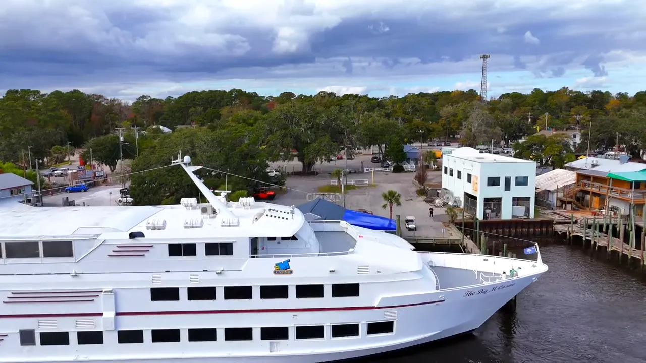 Docked yachts and waterfront marina buildings in Little River SC
