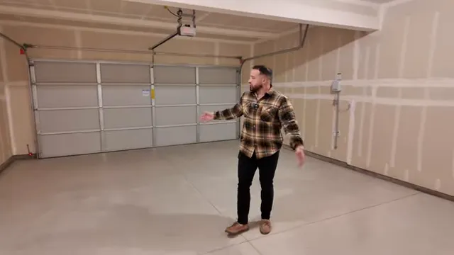 Empty finished two-car garage with double garage door