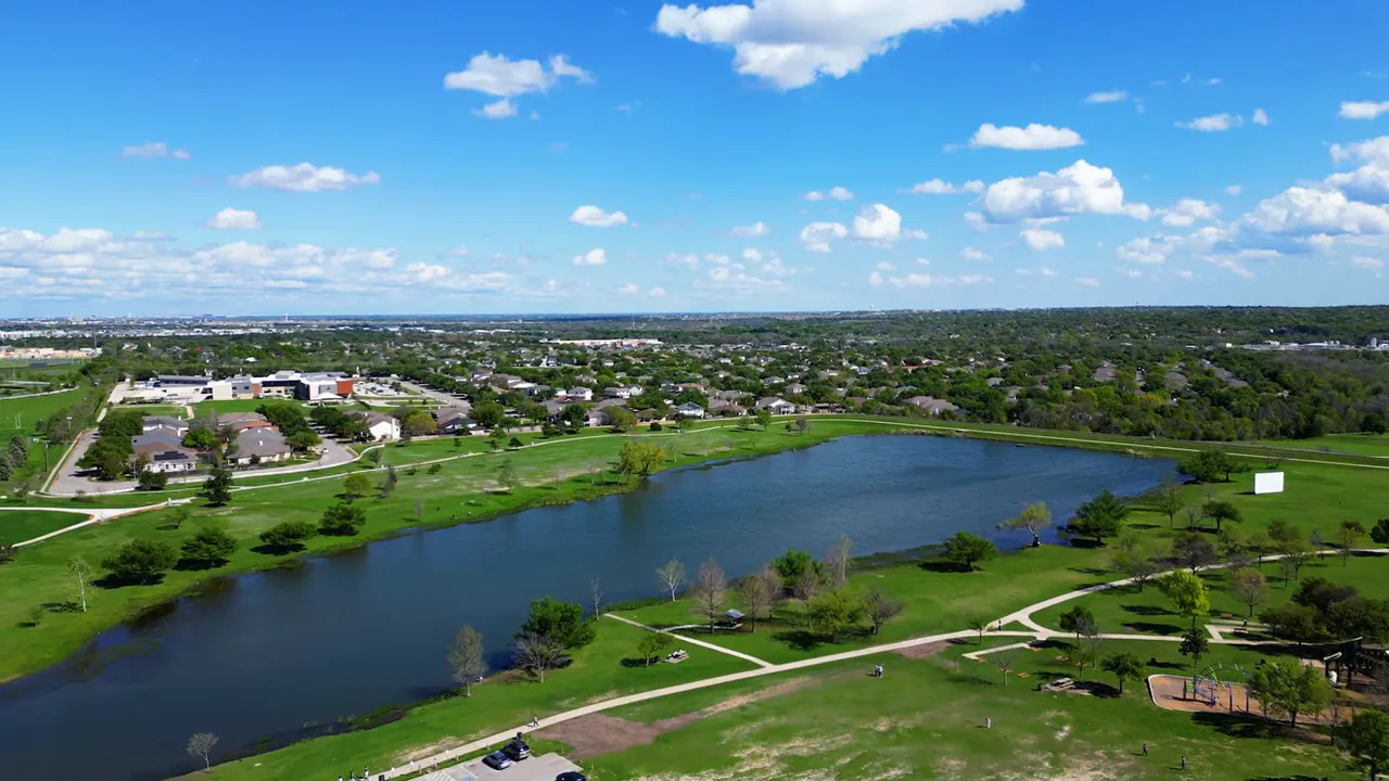 Aerial view of river green space trails and surrounding neighborhoods