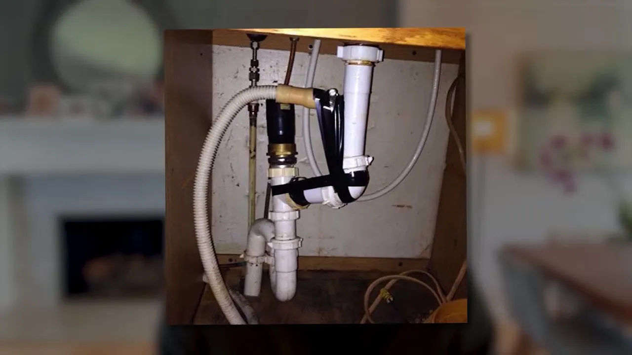 Photo showing plumbing and electrical connections behind an interior wall in a home inspection setting