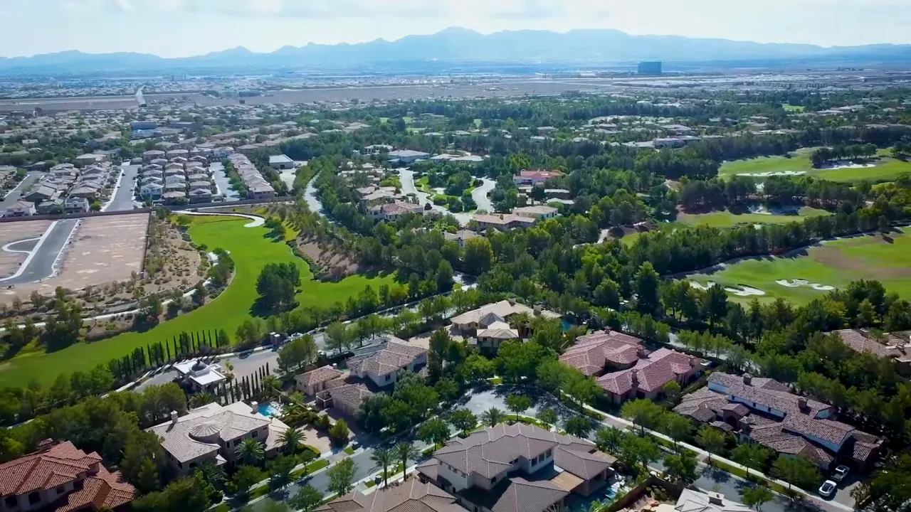 Aerial view of Southern Highlands homes and golf course with 400000 dollar text