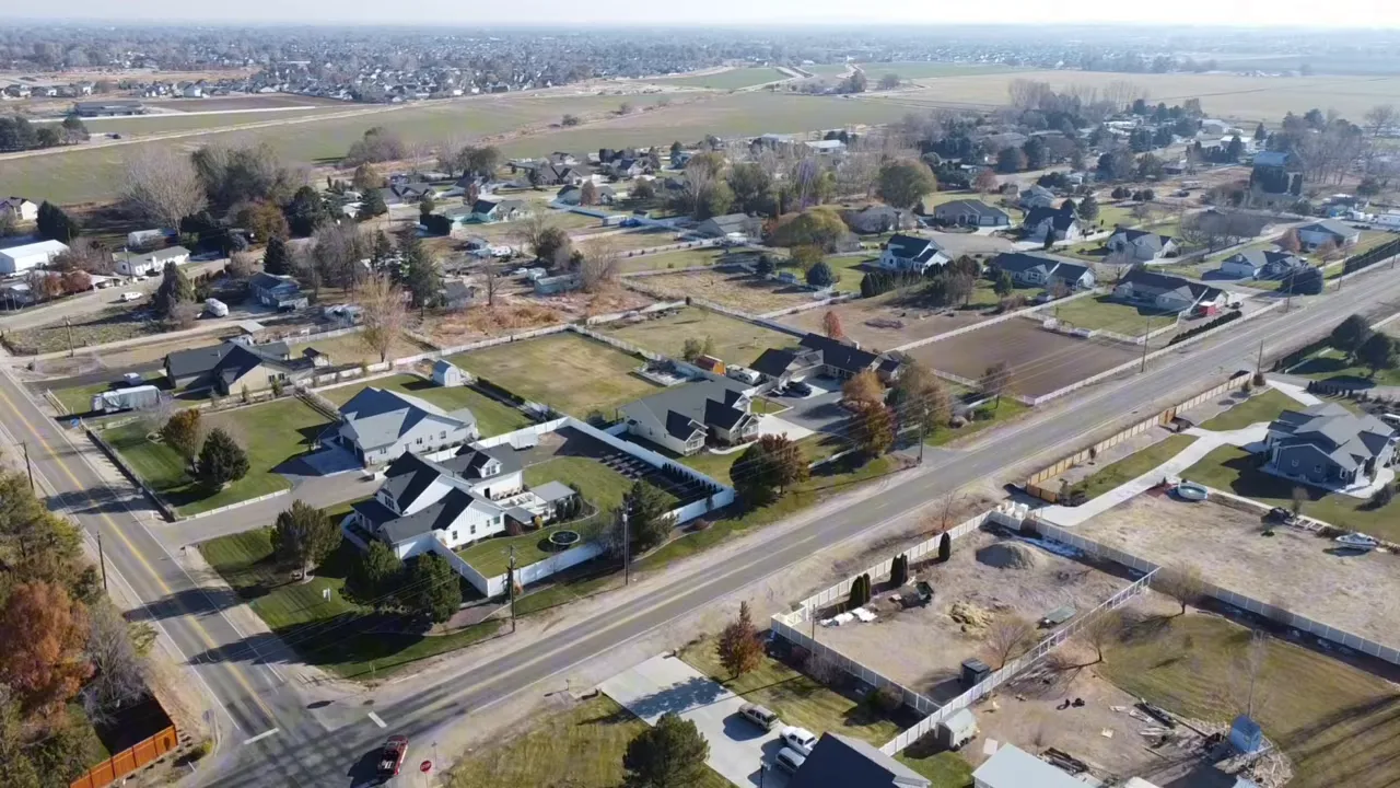 aerial view of nampa neighborhood with homes roads and open land