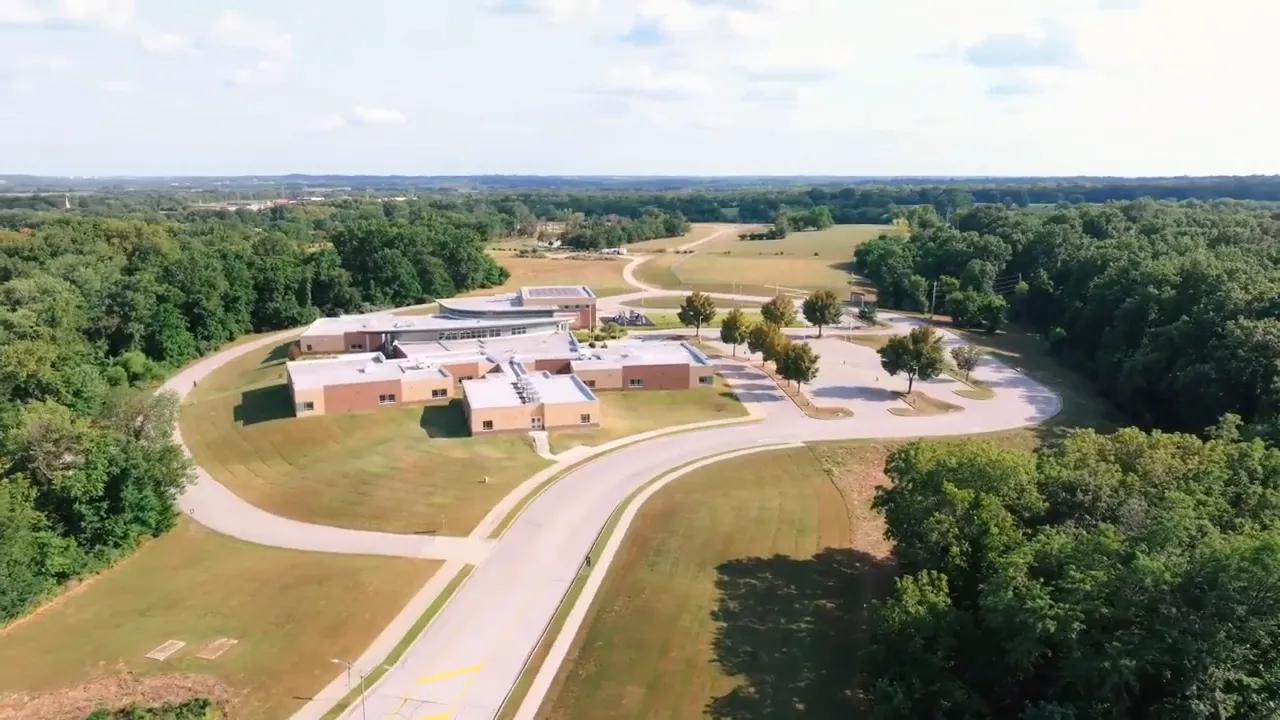 Aerial view showing houses with solar panels and open southern-facing lots in Brookside Place