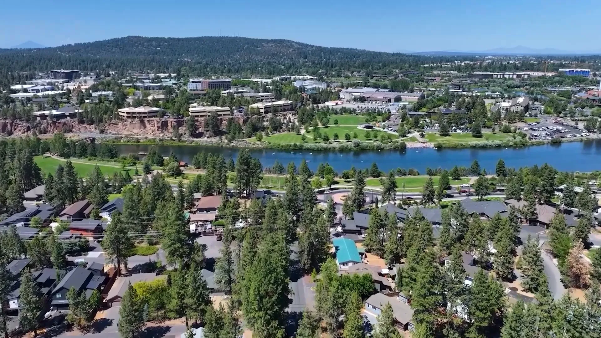 View of Bend with mountains and clear blue skies