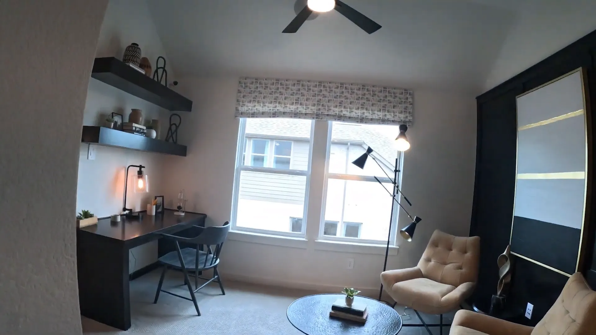 Upstairs office and lounge with desk shelves and large window