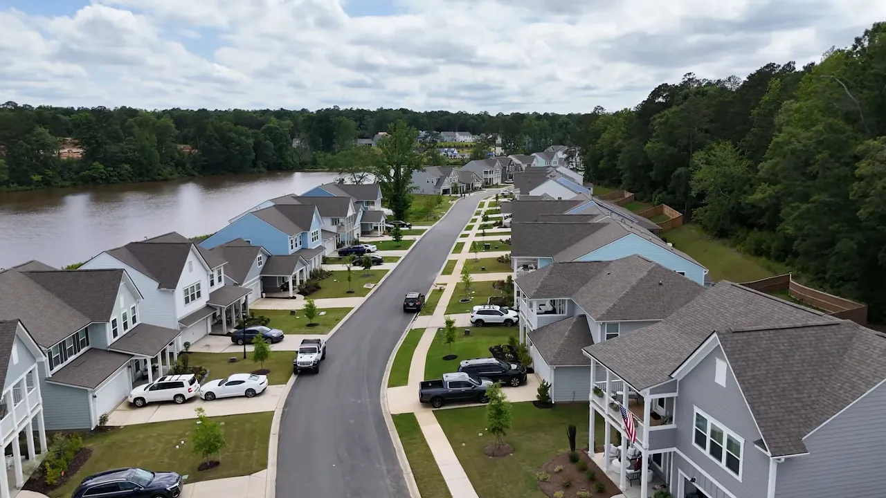 Aerial neighborhood image with text showing four to five times higher non primary residence taxes