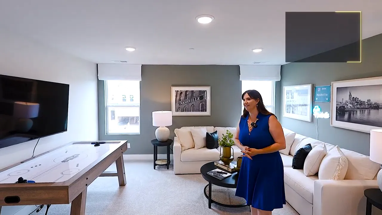 Large upstairs bonus room with sofas game table and television
