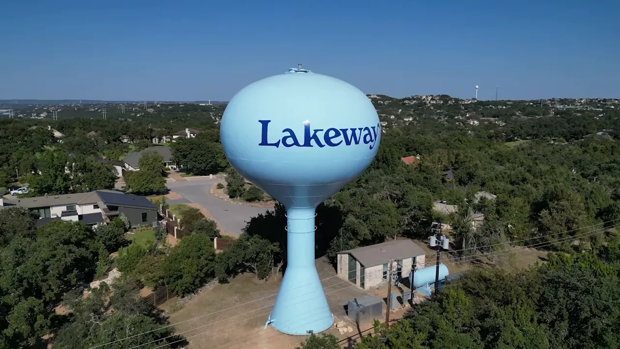 Lakeway water tower above a residential neighborhood