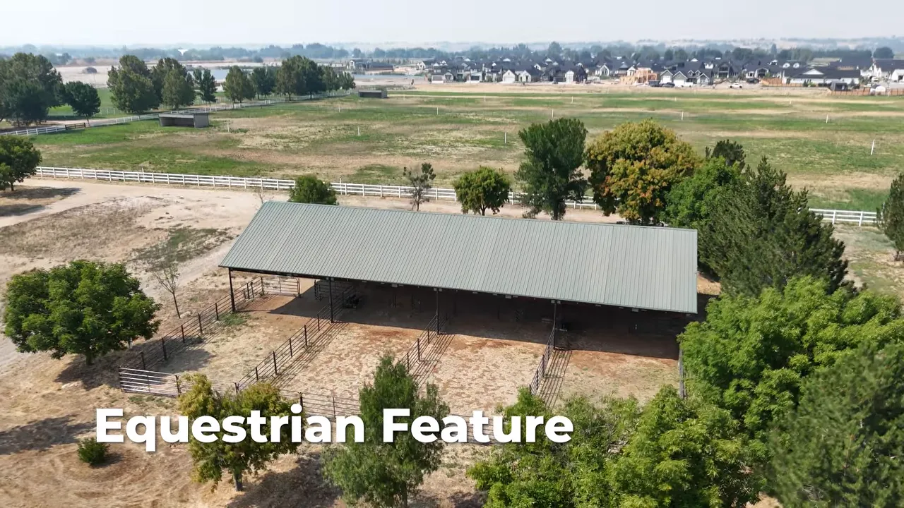 Covered equestrian facility surrounded by open fields