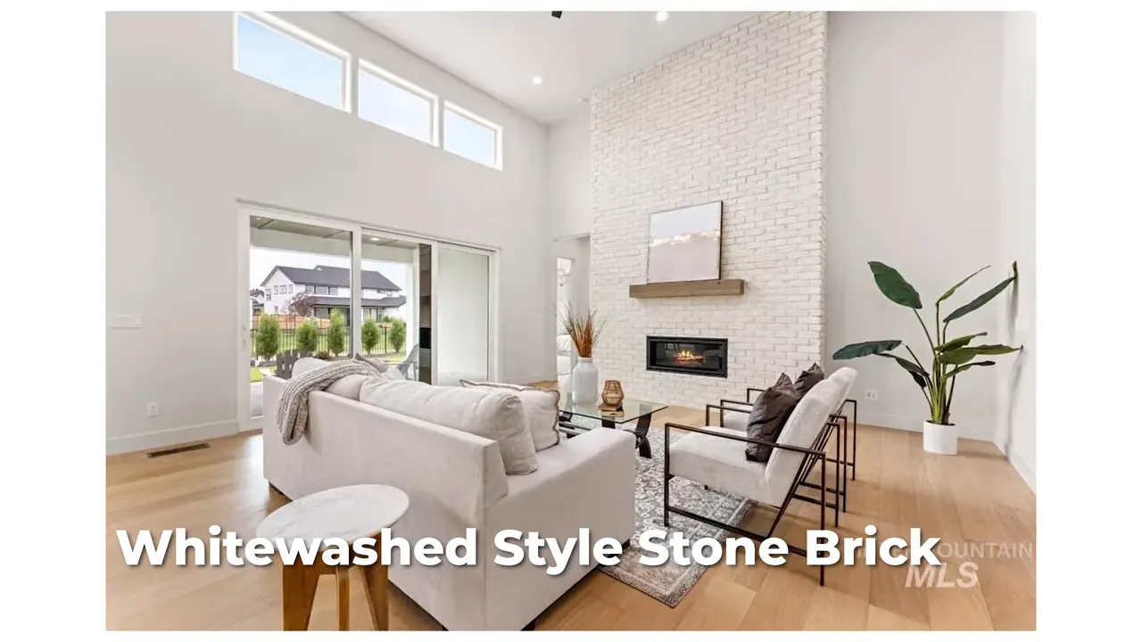 Living room with tall whitewashed stone fireplace and high ceilings