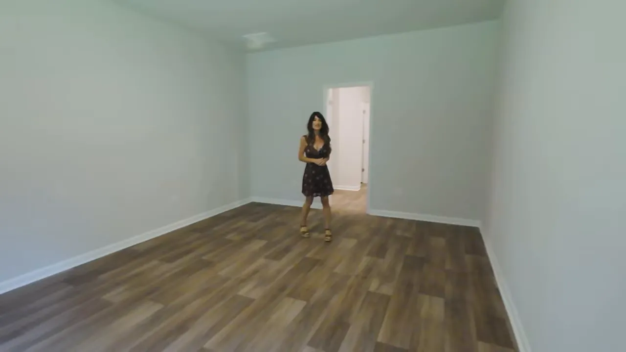 Primary bedroom space with wood-look flooring in a Little River SC new construction home