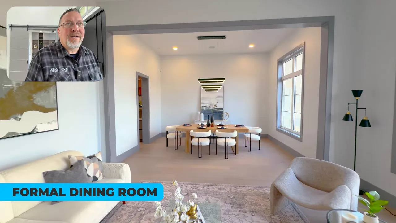 Formal dining room viewed from the living area with a wood table, modern chairs and pendant lighting