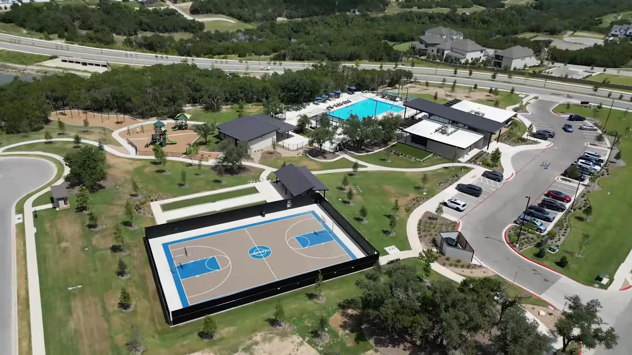 Aerial view of community pools courts buildings and greenbelt trails