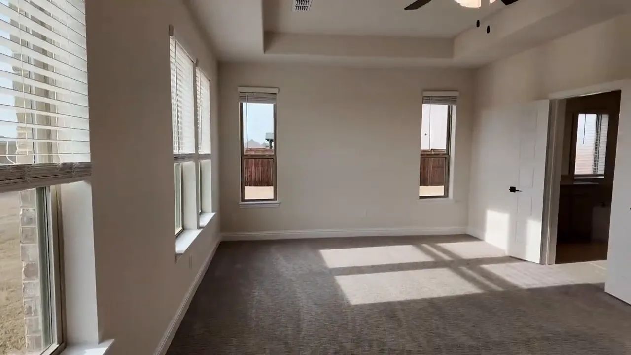 Primary suite room view with large windows and natural light in new homes near Dallas Texas