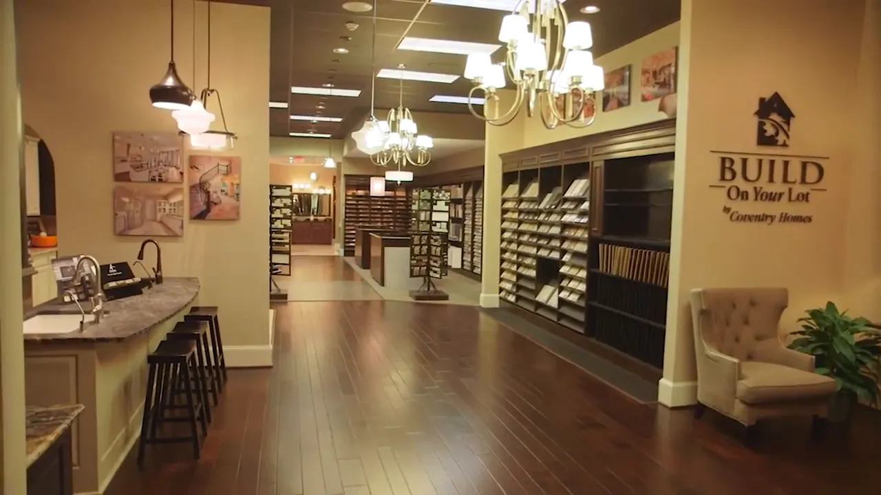 Design center showroom interior with flooring samples and cabinet displays