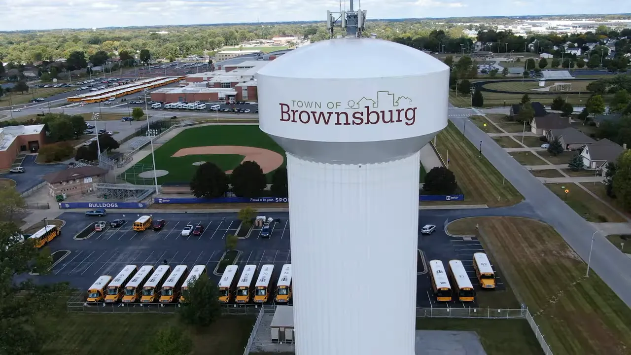 Brownsburg water tower with roads and buildings around it