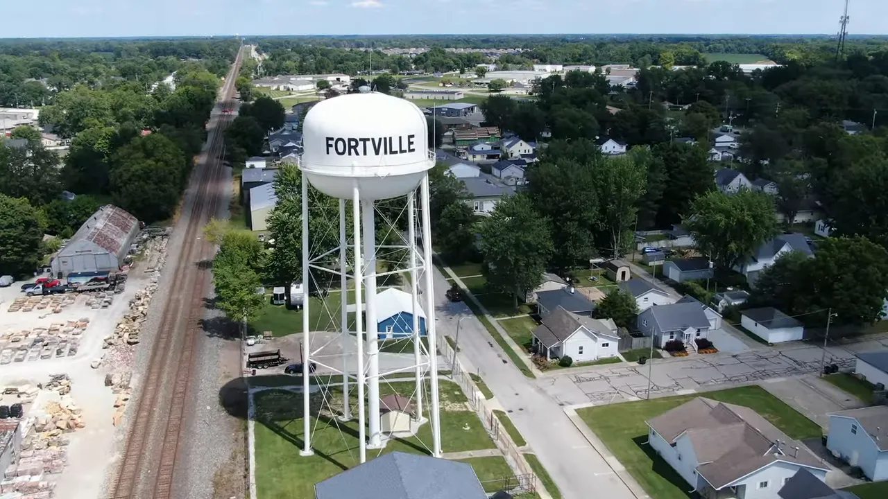 Fortville water tower above a small town neighborhood