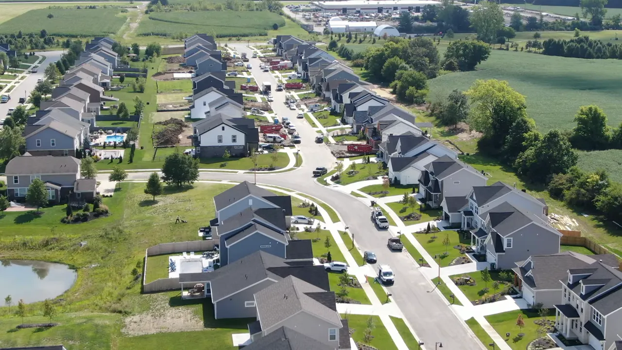 Aerial view of a newer subdivision with houses and curving streets