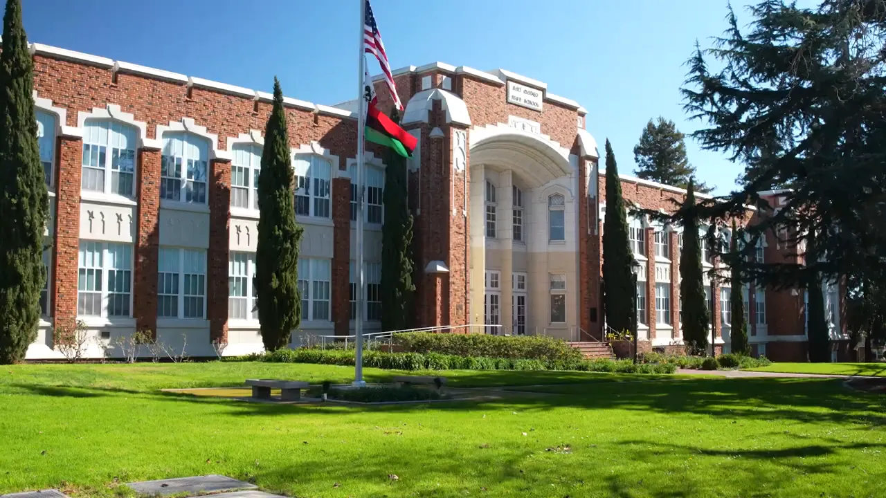 Aragon High School building with staircase and sign