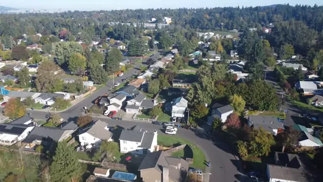 Aerial view of established Milwaukie neighborhood with mature trees and homes