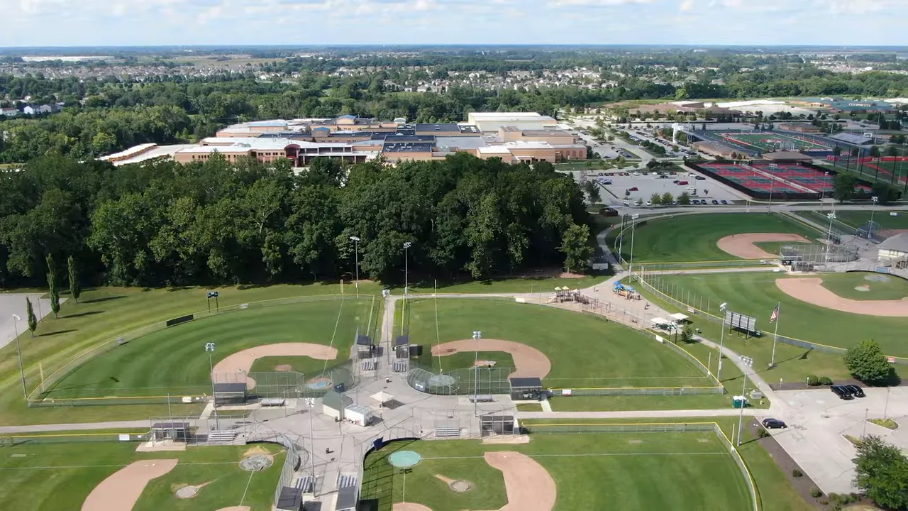 aerial view of multiple baseball diamonds and sports fields