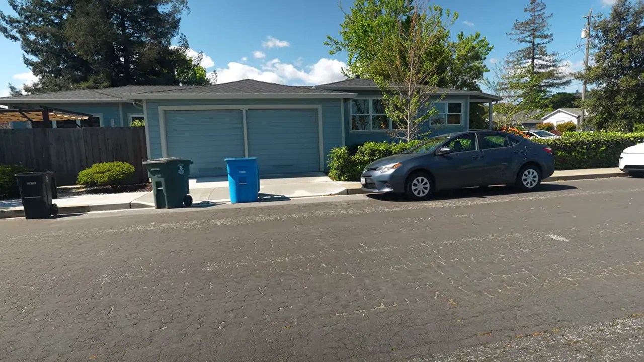 Clearfield Park San Carlos street scene with single-family home, attached garage, and sidewalk
