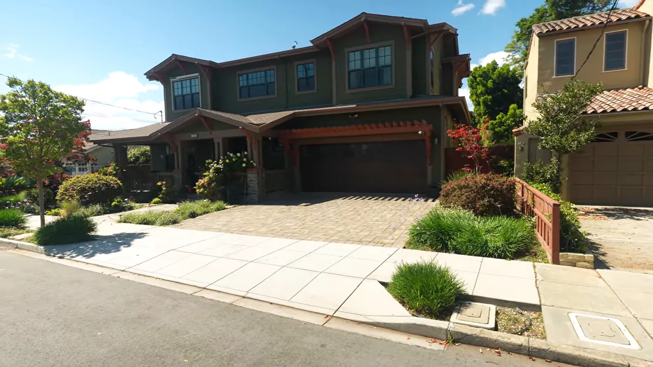 Cordes San Carlos home exterior with driveway, attached garage, and landscaped front yard