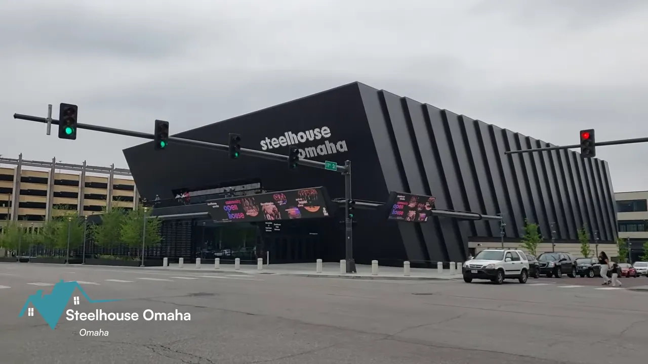 Concert stage lit with colorful lights inside Steelhouse Omaha