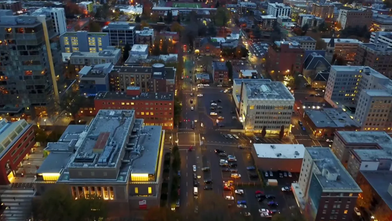 Aerial view of a downtown city intersection at dusk