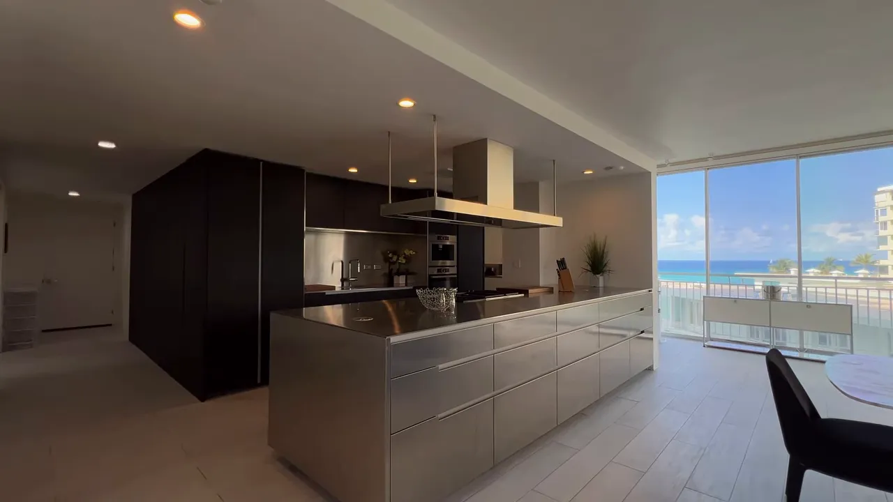 Updated modern kitchen and living area inside a Hawaii condo with ocean view