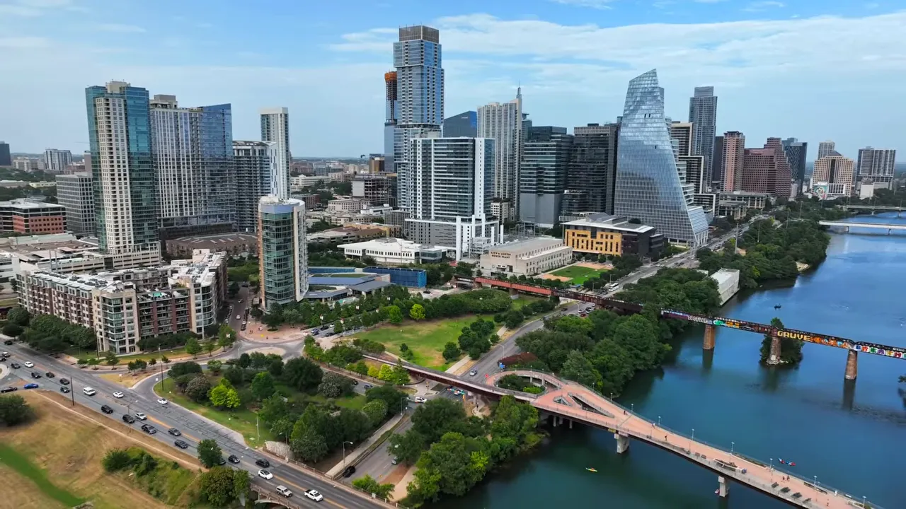 Aerial view of downtown Austin, the lake, and bridges