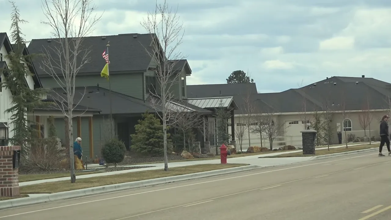 Wider view of a Boise neighborhood street with well-kept homes