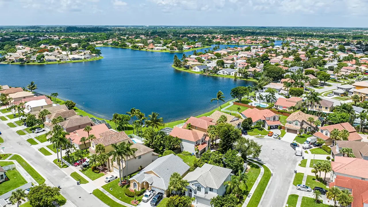 Aerial views of lakefront neighborhoods walking paths and families outdoors