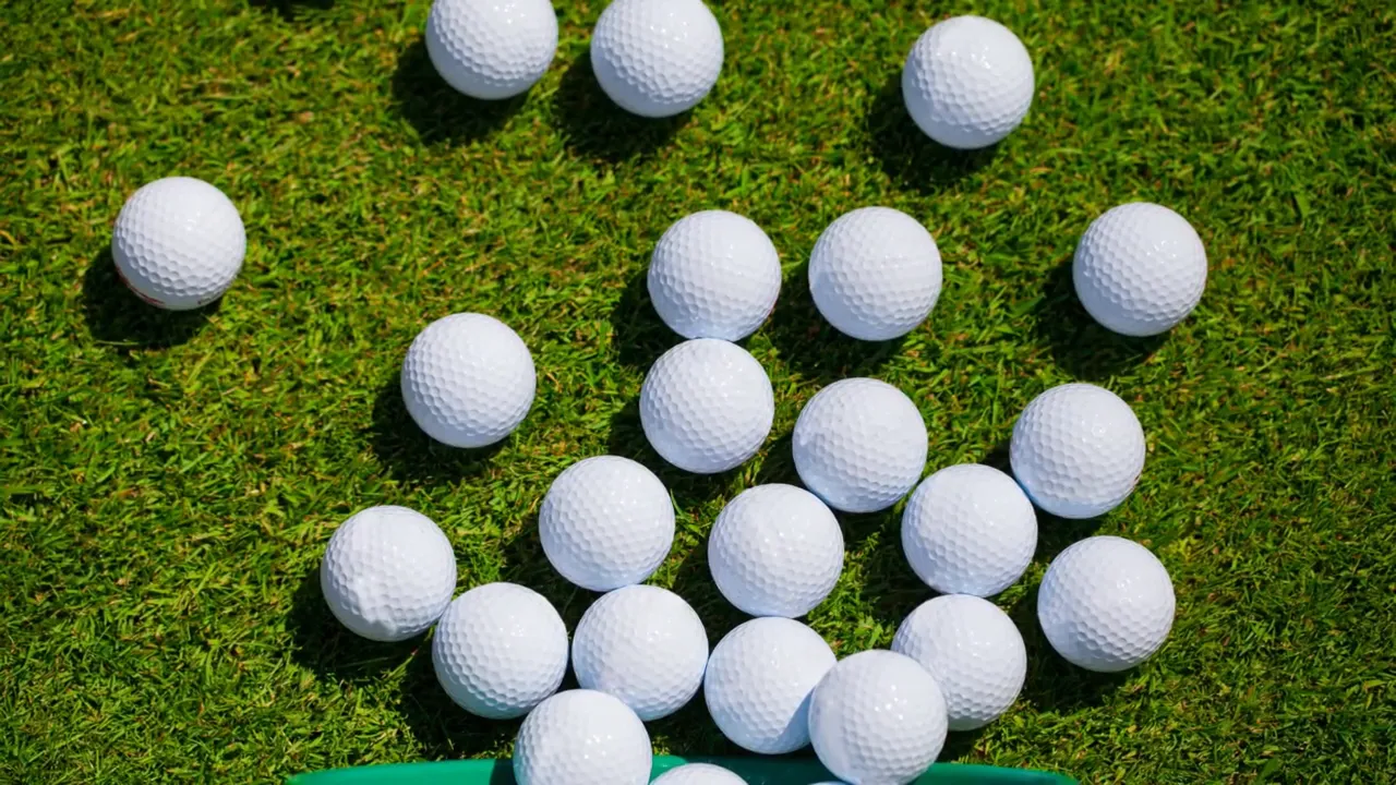 Golf balls on grass indicating potential landing-zone impact risk for a golf course home