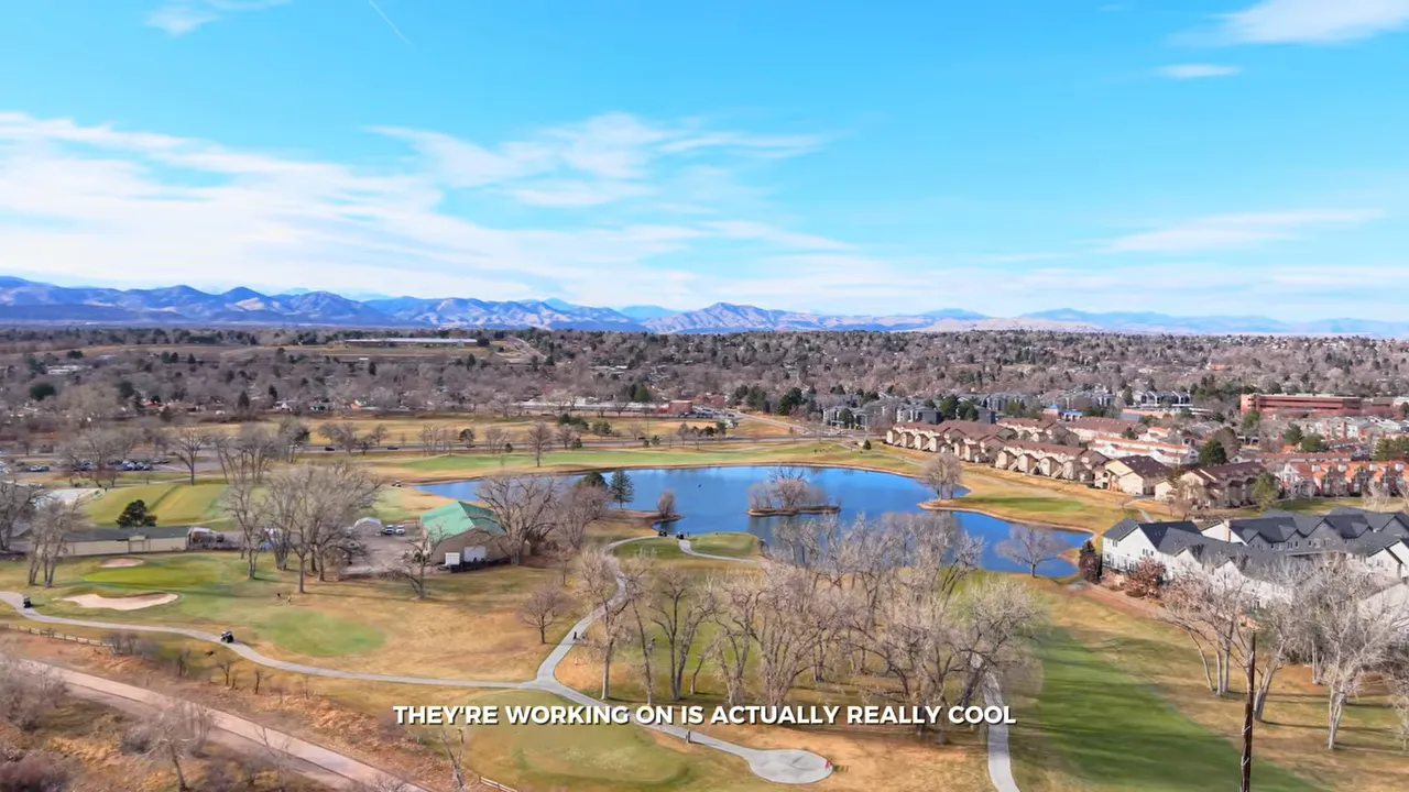 Aerial view of river trails ponds homes and mountain views near Littleton