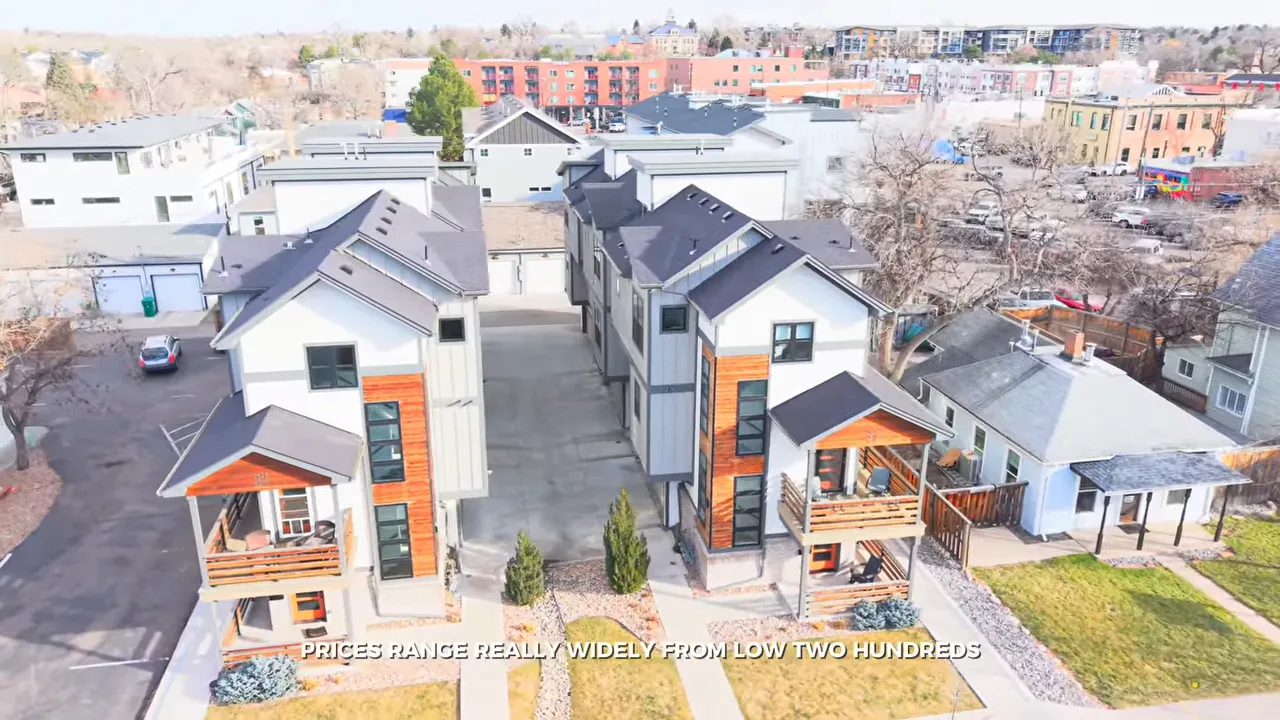 Aerial view of modern townhomes beside older homes near downtown Littleton