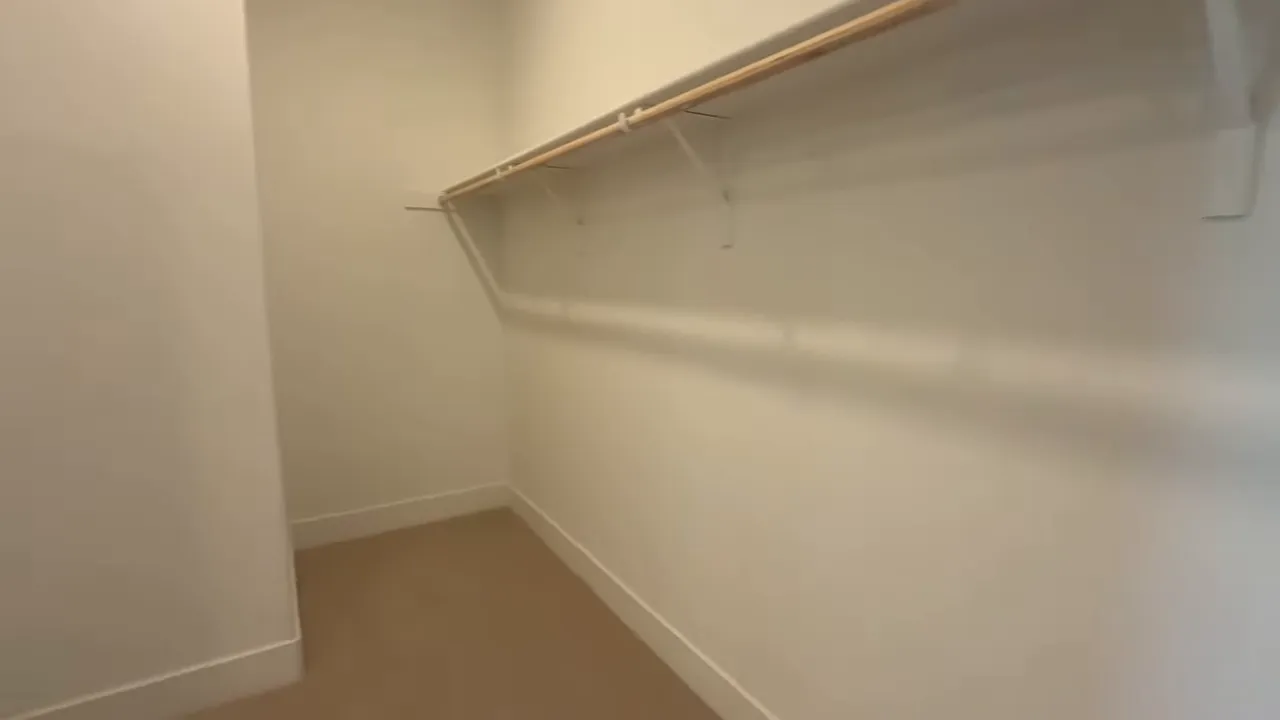 Closet storage corner with hanging rods in Arbor Ranch Elk Grove home