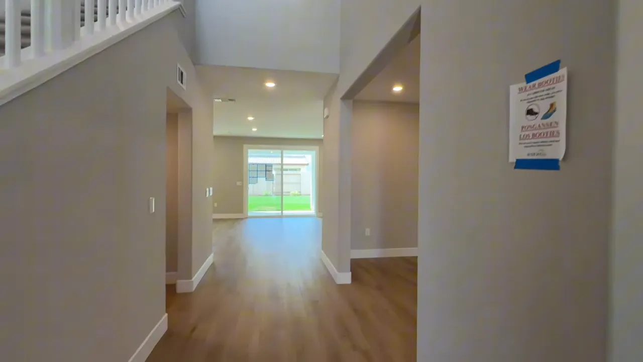 Bright entry hallway with recessed lighting and open view at Arbor Ranch Elk Grove home
