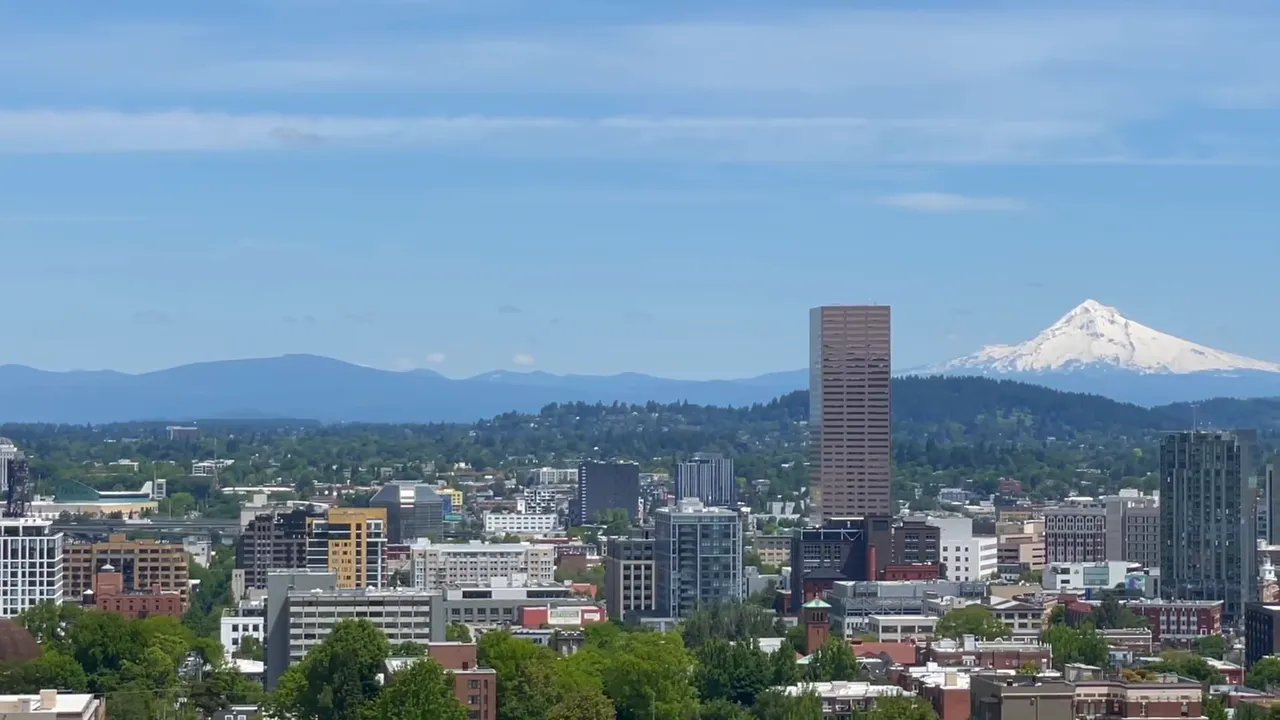 Panoramic view of Portland with buildings and Mount Hood in the background