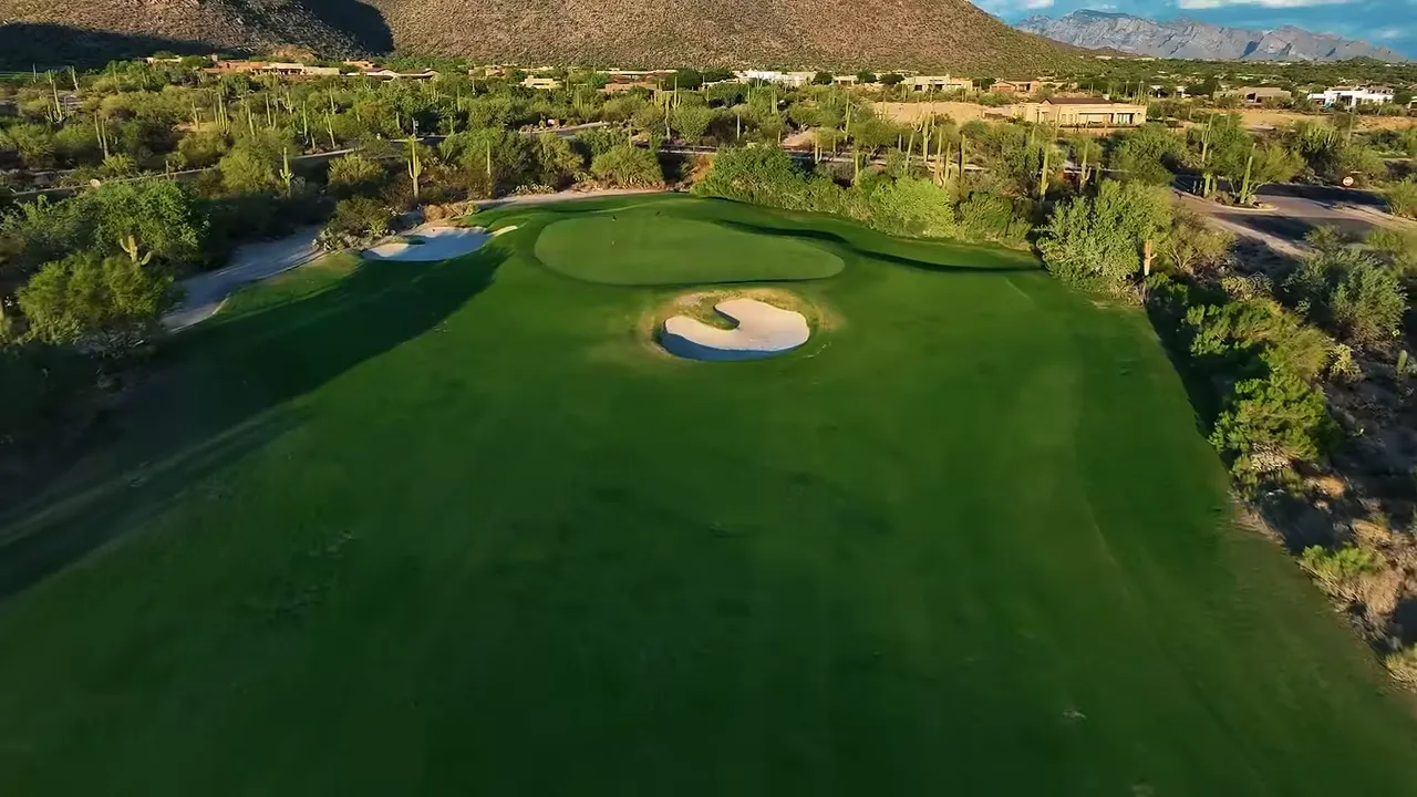 Golf course fairway surrounded by the Tortolita Mountains at Dove Mountain