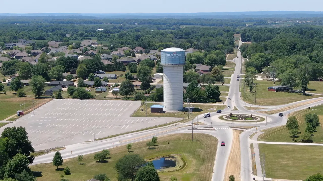 Aerial view of Bargersville water tower, roundabout, parking area and surrounding suburban neighborhoods