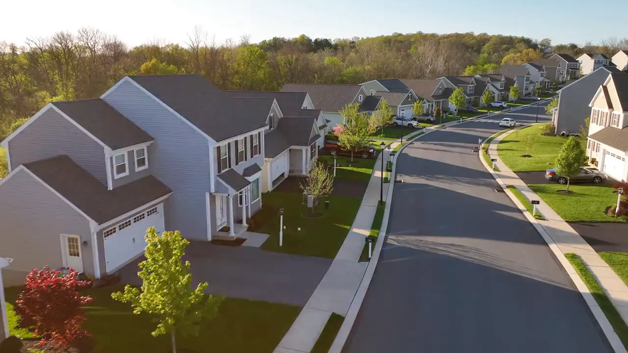 Aerial view of a planned community in DFW showing new homes and street layout