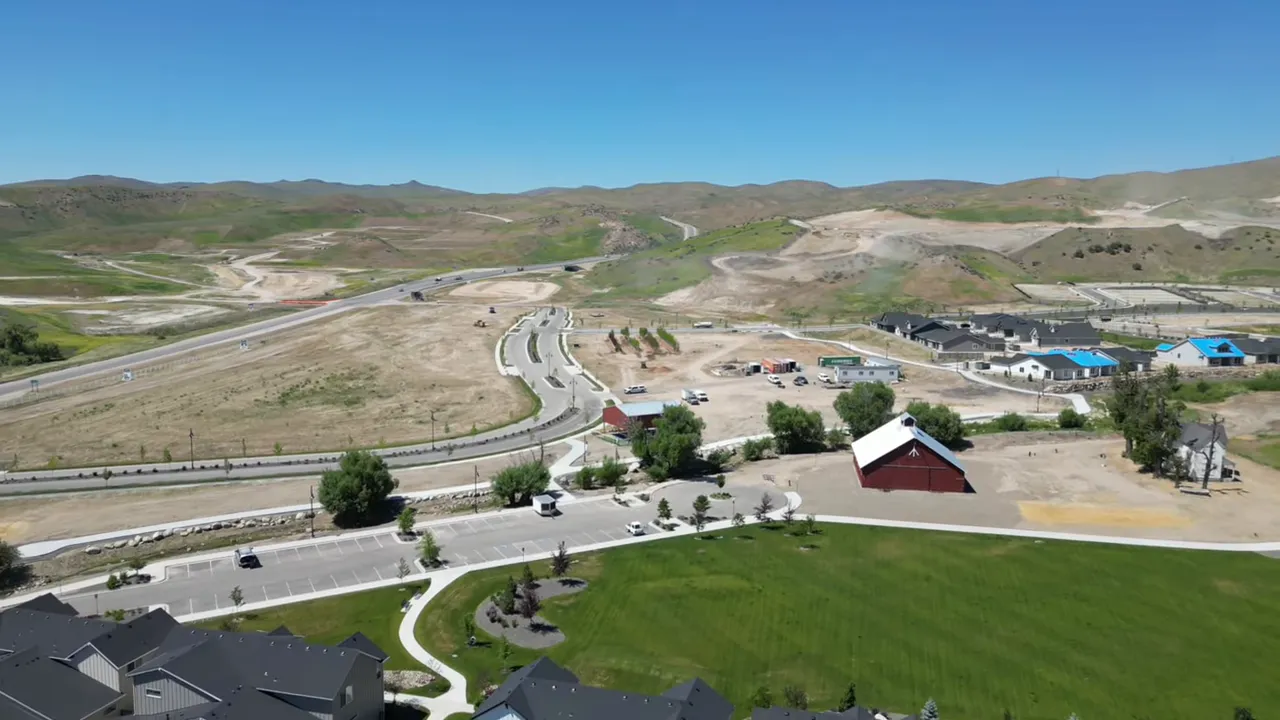wide aerial of Avimor showing graded lots, drainage swales, park and foothills