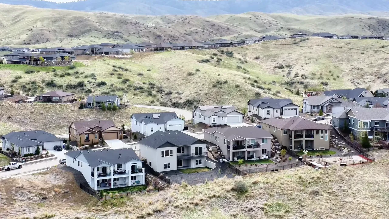 Aerial view of Avimor homes on rolling foothills showing spacing and open natural land