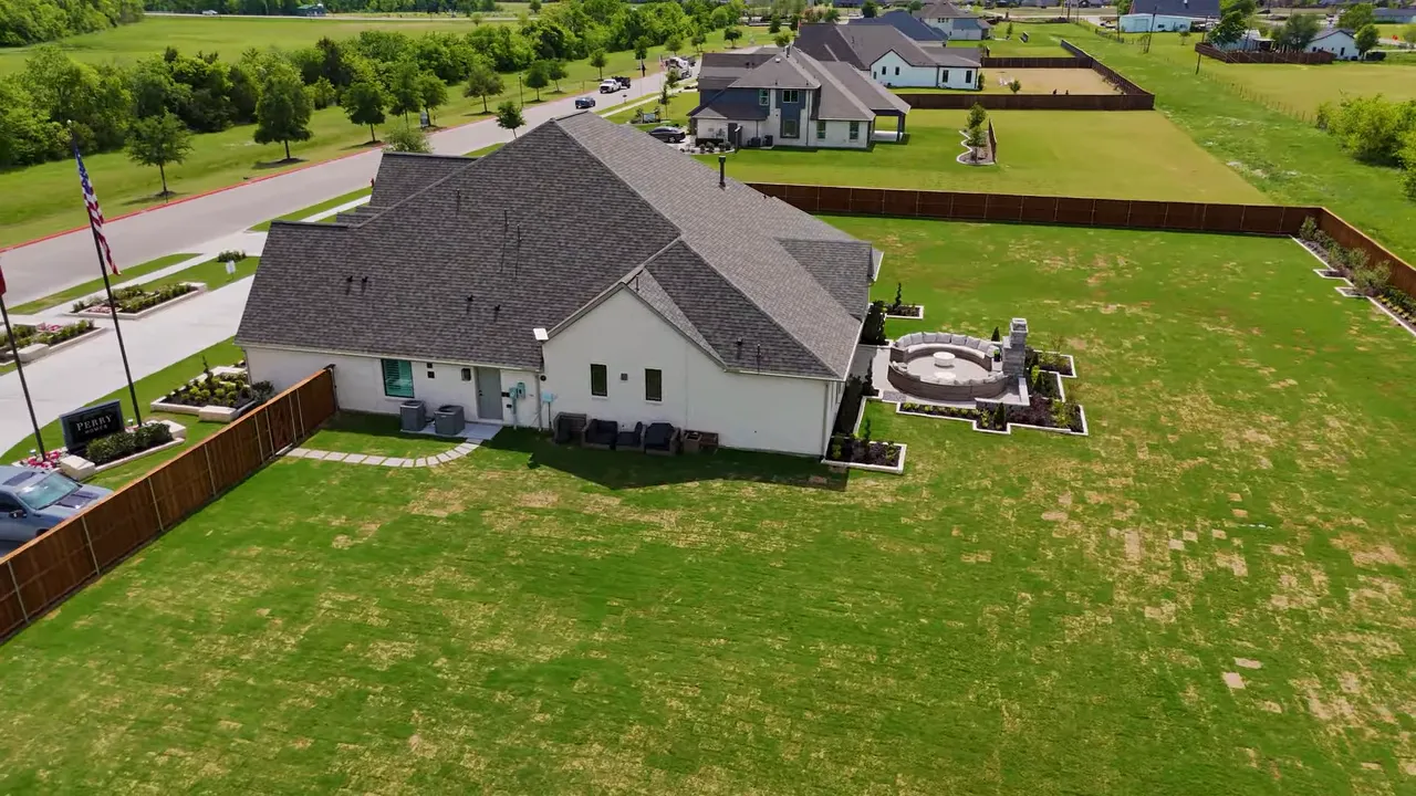 Aerial view of a Perry Homes backyard and outdoor patio area with generous lot size in Sonoma Verde